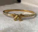 Bow with diamond bangle bracelet