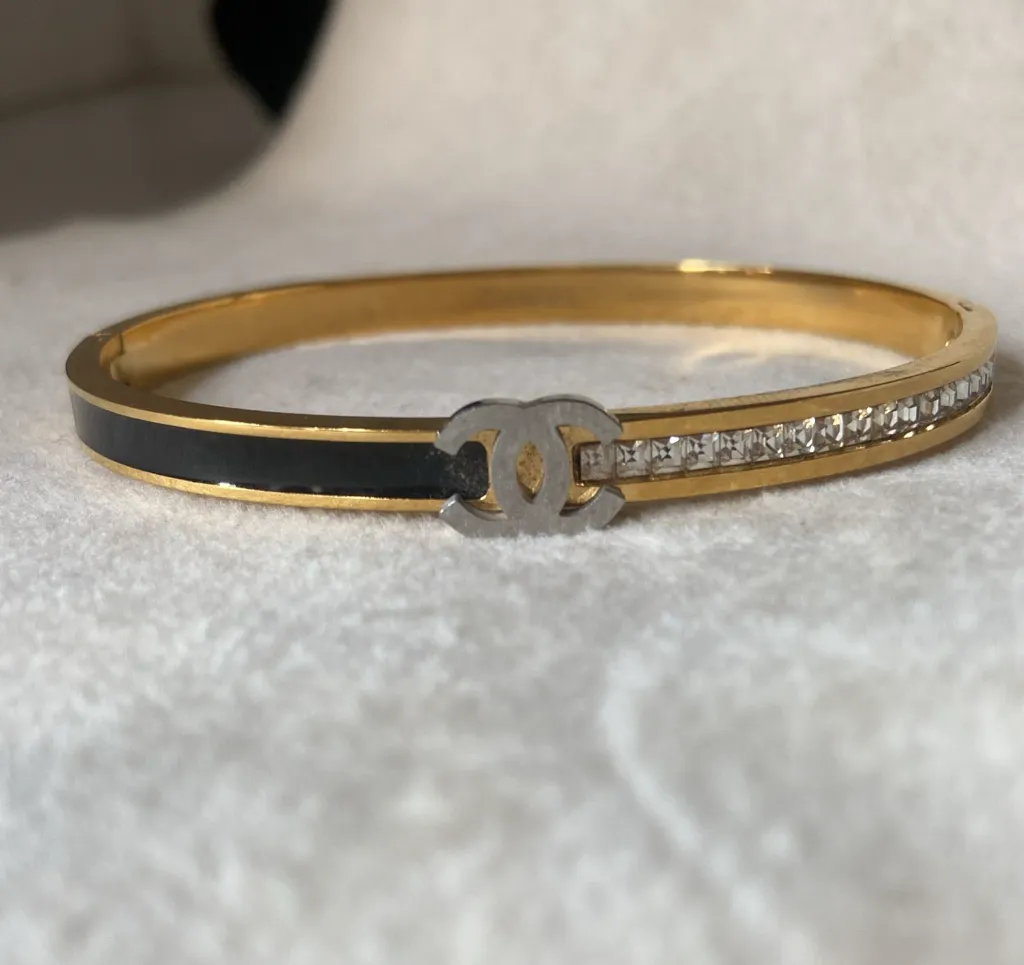Channel black and diamond bangle bracelet