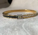Channel black and diamond bangle bracelet